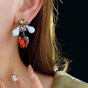Vintage-style bee earrings with colorful gemstones and red teardrop pendant