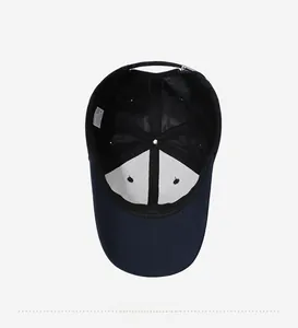 Detail view of the navy blue baseball cap interior with white lining and fabric care label