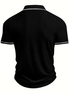 Rear view of black ribbed knit polo shirt featuring white dual stripe trim on sleeves