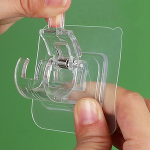 Transparent adhesive curtain rod bracket with spring clip mechanism for drill-free mounting