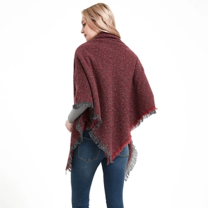 Thick knit red shawl with melange texture and fringe tassels for autumn and winter