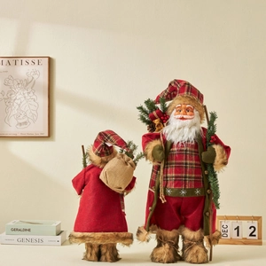 Standing Santa Claus figurines in red plaid outfits for festive Christmas home decor