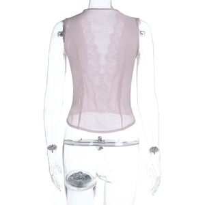 Close-up of the sheer pink lace fabric and delicate floral texture on the back of the tank top