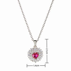 Detailed view of heart necklace pendant showing dimensions 2.1cm by 1.4cm with pink zircon