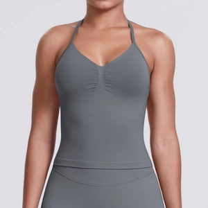 Detail of seamless knitted racerback sports vest with v-neck and pleated texture