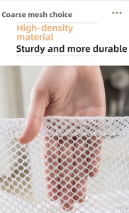 Detailed close-up of high-density thick mesh laundry bag fabric with honeycomb structure