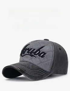 Detail of grey washed canvas baseball cap featuring Aruba embroidery and quilted pattern