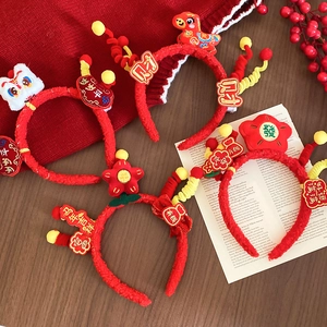 Detailed view of red plush lunar new year headbands with traditional lion dance and embroidery