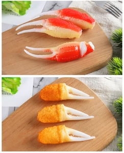Close-up of realistic crab claw food models with natural and golden fried textures