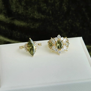 14k gold plated open ring set with oval green zircon and marquise cut gemstone design