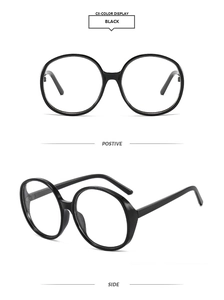 Detailed view of black thick-frame round oversized glasses with polished resin finish