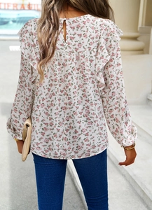 Detail view of floral chiffon long sleeve top showing ruffled edges and back button closure