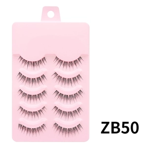 Detail view of 5 pairs of natural black false eyelashes on a pink tray, model ZB50