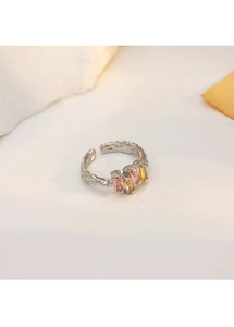 Detail of silver irregular geometric ring with colorful pink orange and yellow gemstones