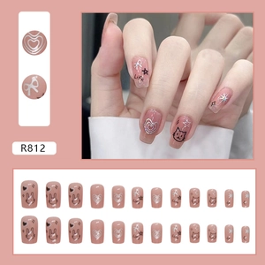 Sweet pink press-on nails set with cute black hand-drawn cat and heart patterns