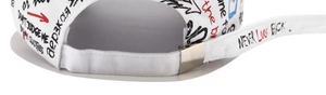 Detail of adjustable metal buckle and street graffiti print on white baseball cap