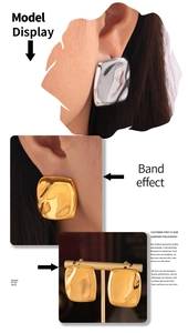 Detailed view of geometric irregular textured earrings in gold and silver finish
