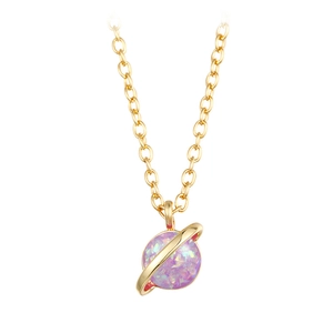 Macro detail of gold opal planet necklace featuring shimmering pink purple gemstone