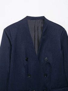 Detail of navy blue collarless double-breasted blazer with four-hole dark buttons