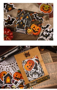 Halloween sticker set with cartoon pumpkin and ghost designs in a kraft gift box
