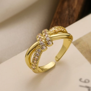 Elegant 18K gold plated knotted open ring featuring pave-set cubic zirconia gemstones