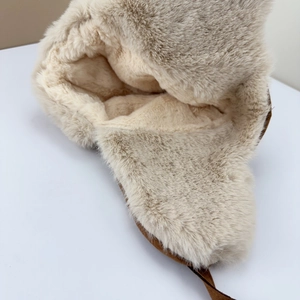 Close-up of thick cream faux rabbit fur and plush lining for superior winter warmth