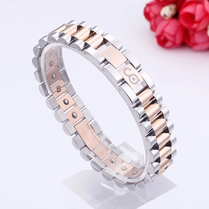 Macro shot of bicolour watch band style bracelet with Germanium 99.99% engraving