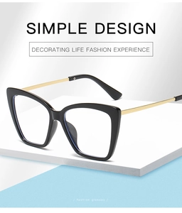 Detail of stylish black and gold butterfly frame glasses with elegant metal temples
