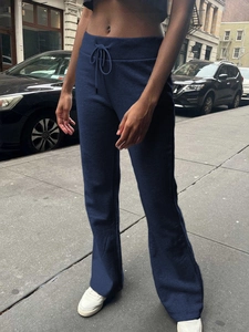 Women's dark blue drawstring sports trousers with slightly flared legs and casual style
