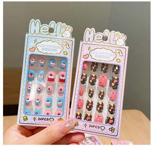 Close-up of cute cartoon nail sticker sets featuring blue cake and pink heart themes