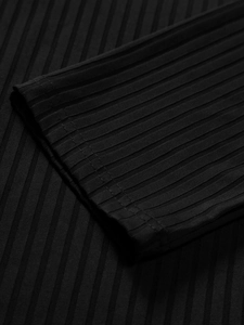 Detail of ribbed knit cuffs and double-needle stitching on men's black athletic polo