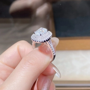 Macro view of luxurious 4-carat rectangular cut moissanite ring with halo setting