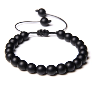 Handmade woven tiger eye stone bracelet with matte black beads and adjustable cord