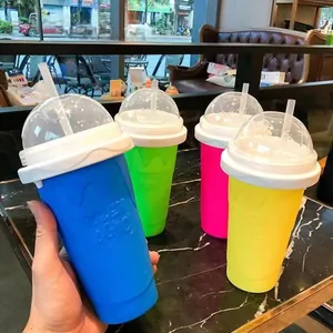 Detailed view of Frozen Magic slushy maker cups in four colors with lids and straws