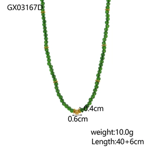 Detail view of green translucent beads with gold spiral center bead and length measurements