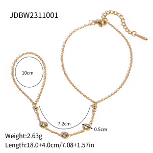 Polished gold stainless steel hand chain bracelet with zircon stones and finger ring