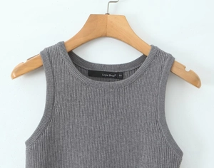 Detail of grey ribbed knit sleeveless tank top showing round neck and fabric texture