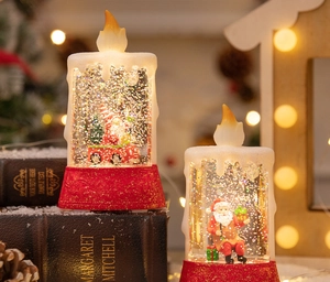 Detail of Christmas LED water candle with Santa and festive liquid glitter effect