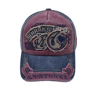 Vintage washed baseball cap featuring a shark patch design in red and navy contrast