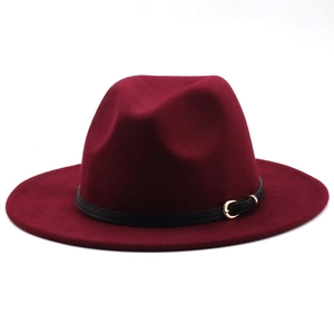 Detail of wine red fedora hat featuring a black leather belt with a golden metal buckle