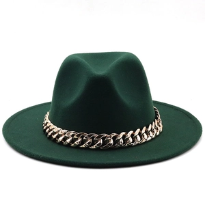 Detail of dark green wide-brim fedora hat with decorative thick gold chain link