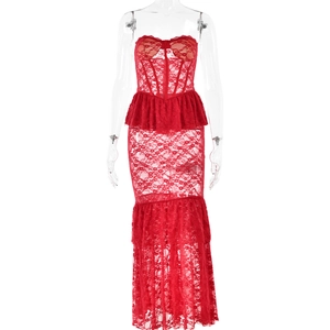 Detail of red lace dress showing the corset bodice, waist ruffle, and sheer tiered skirt
