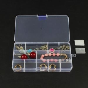 Detail of 10-compartment clear plastic jewelry box with removable dividers for rings
