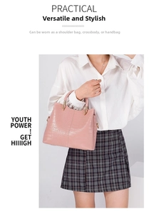 Detailed view of pink crocodile pattern texture on a versatile large capacity handbag