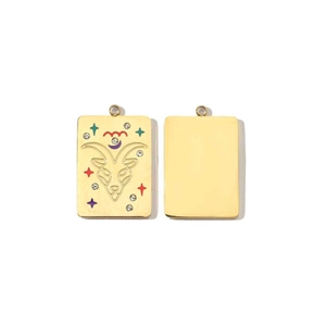 Macro view of 14K gold Aries pendant with colorful crystals and stylized ram pattern
