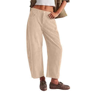 Detail of high-waist corduroy pants showing beige texture and utility side pockets