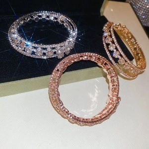 Detailed view of luxury three-row zircon elastic bangles in gold, silver, and rose gold