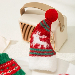 Mini knitted Christmas hat ornament with reindeer pattern and festive red pompom topper