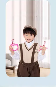 Pink giraffe suction cup robot toy with flexible tubes in a playful home setting