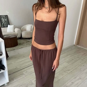 Detail showing the soft chocolate brown fabric texture of the camisole and maxi skirt set
